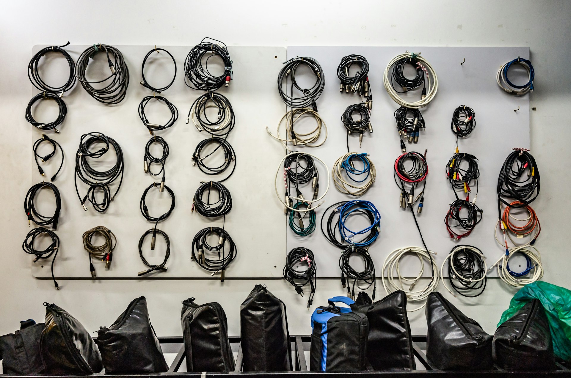 a wall with diffCABLE AUDIO PRO erent items on it